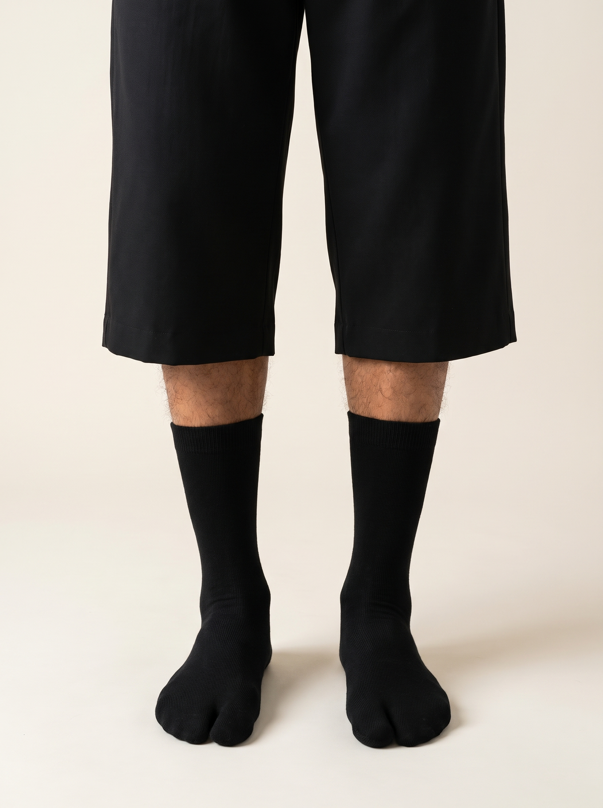 Cotton tabi split-toe socks worn with black shorts