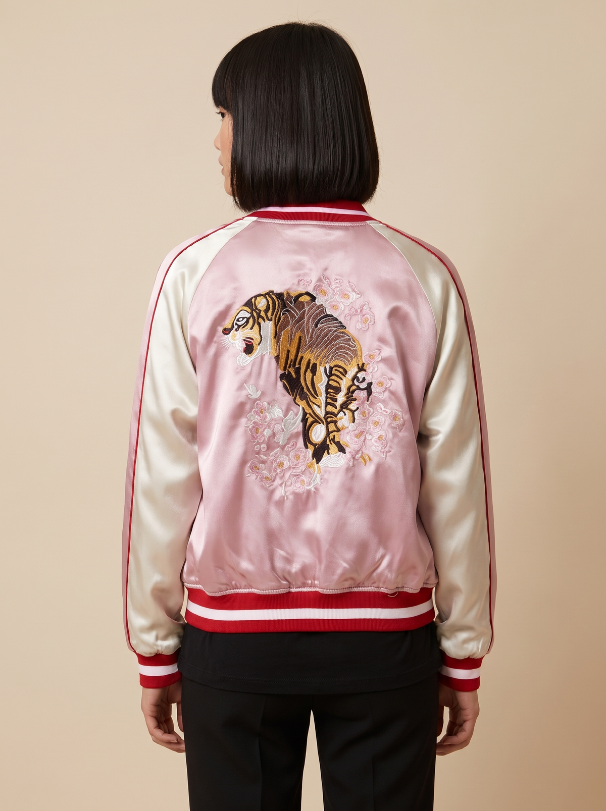 Women's reversible satin sukajan turned to the pink side, back view with embroidered tiger