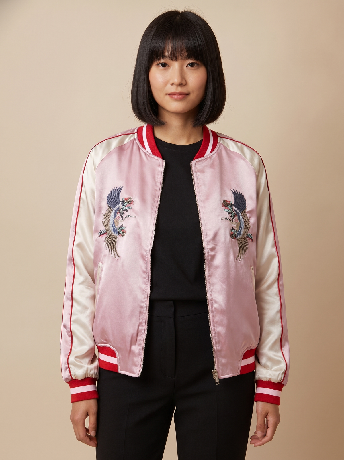 Women's reversible satin sukajan turned to the pink side, front view on model with embroidered cranes