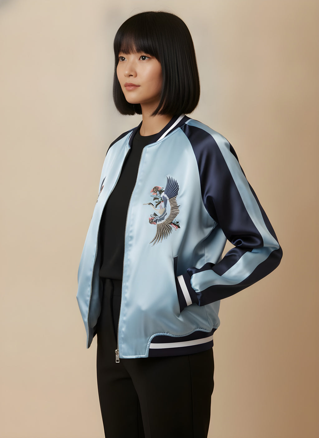 Women's reversible satin sukajan turned to the light blue side, side view on model