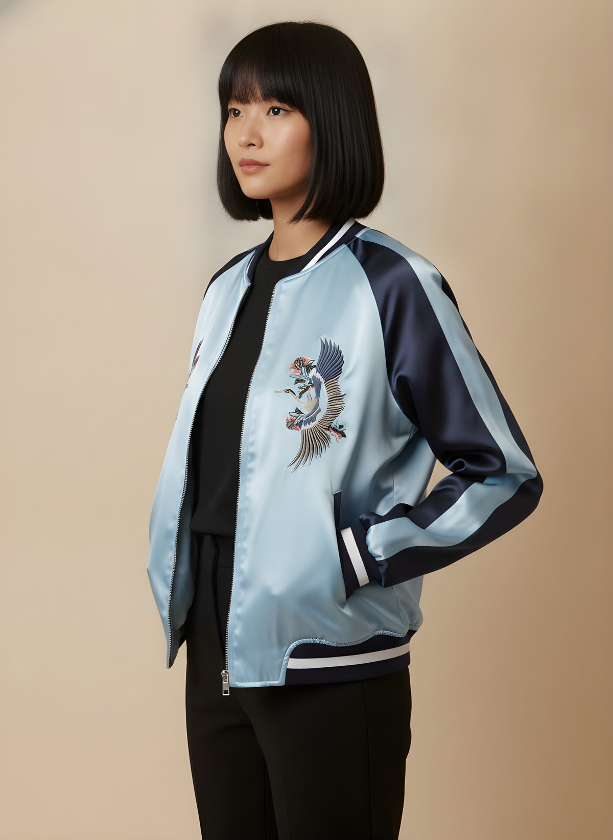 Women's reversible satin sukajan turned to the light blue side, side view on model
